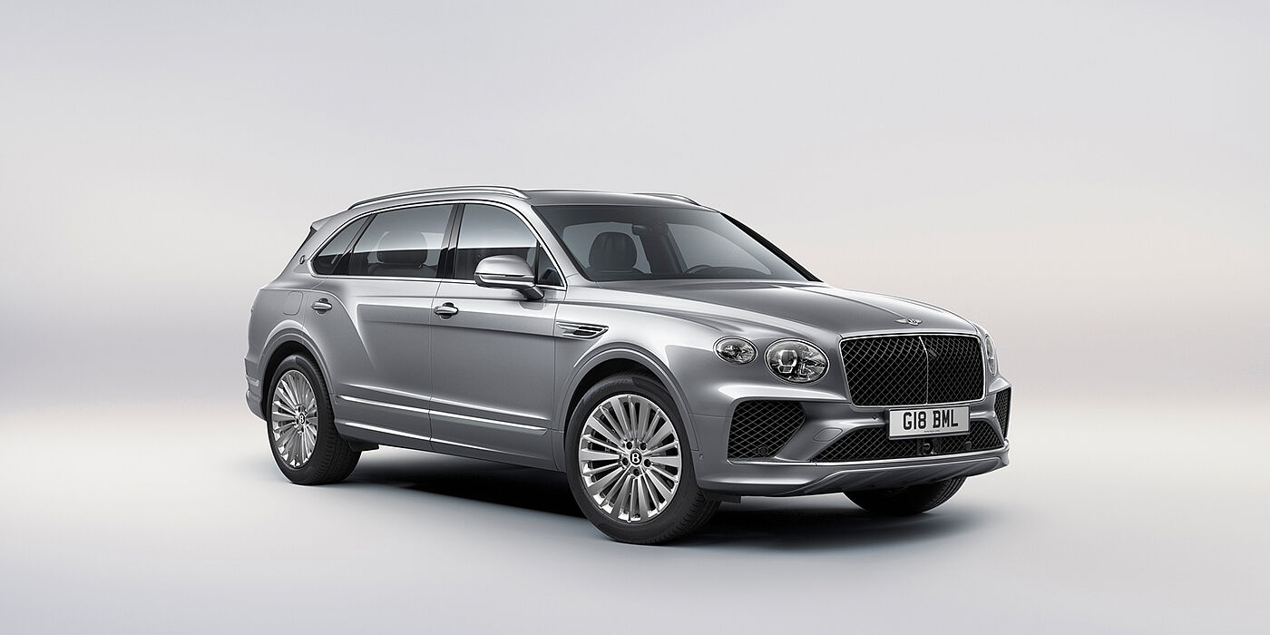 Bentley Hampshire Bentley Bentayga Extended Wheelbase luxury SUV front three quarter view in Moonbeam paint with 21 inch five spoke painted wheels