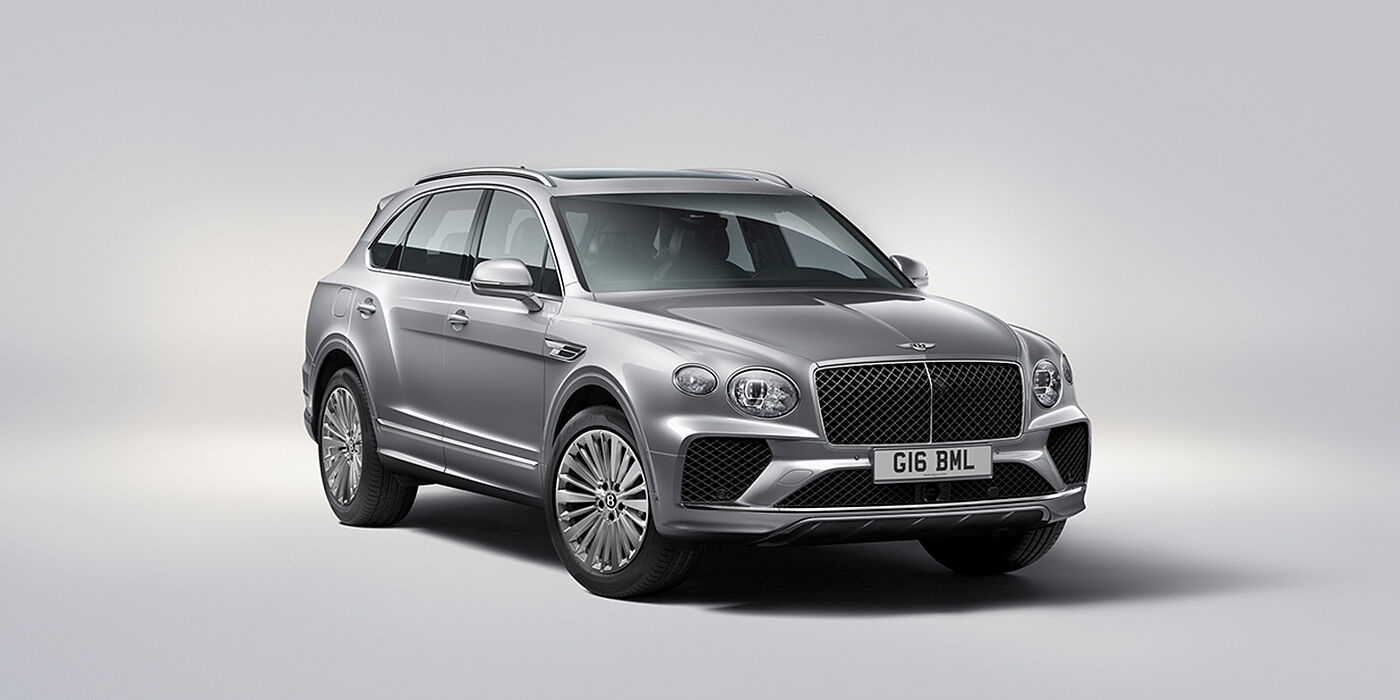 Bentley Hampshire Bentley Bentayga luxury SUV front three quarter view in Moonbeam paint with matrix grille and 21″ 5 spoke painted wheels