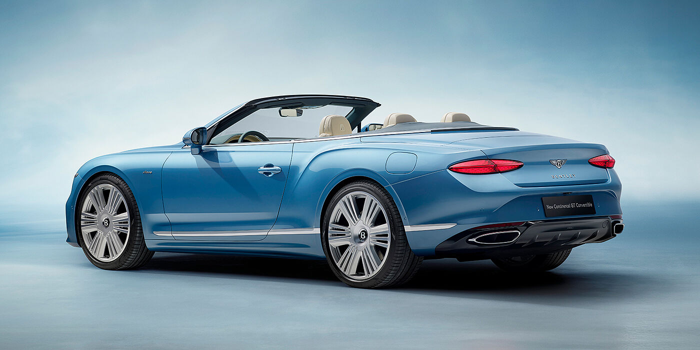 Bentley Hampshire New Bentley Continental GTC Azure convertible rear view in Light Windsor blue paint with 22 inch ten spoke wheels and chrome exterior details