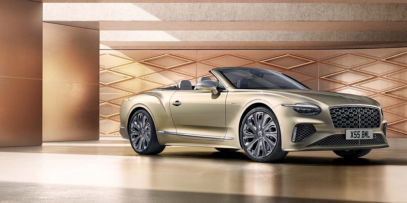 Bentley Hampshire Bentley New Continental GTC Mulliner V8 hybrid front three quarters in Patina paint